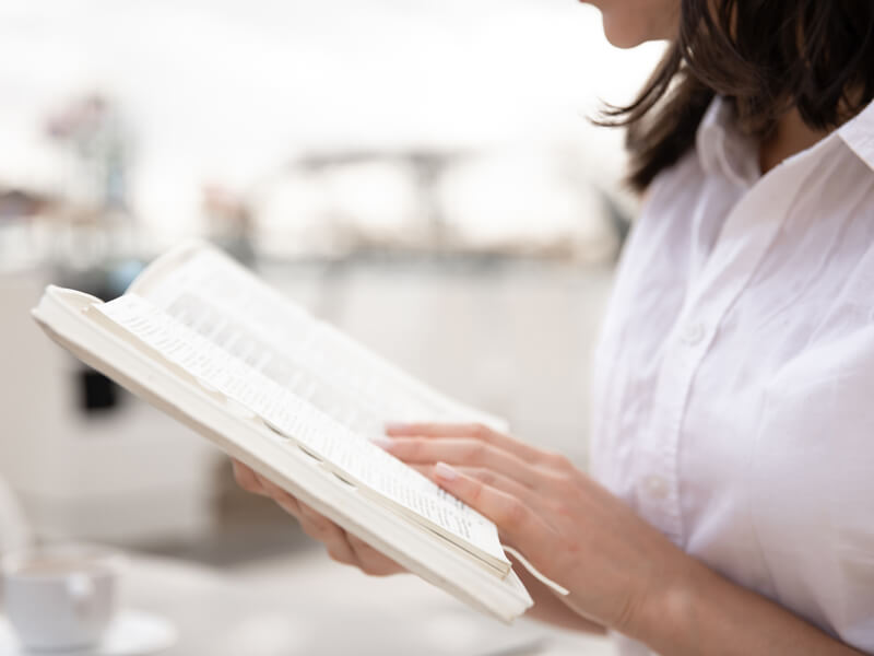 Female Hands Holding A Book Close Up.